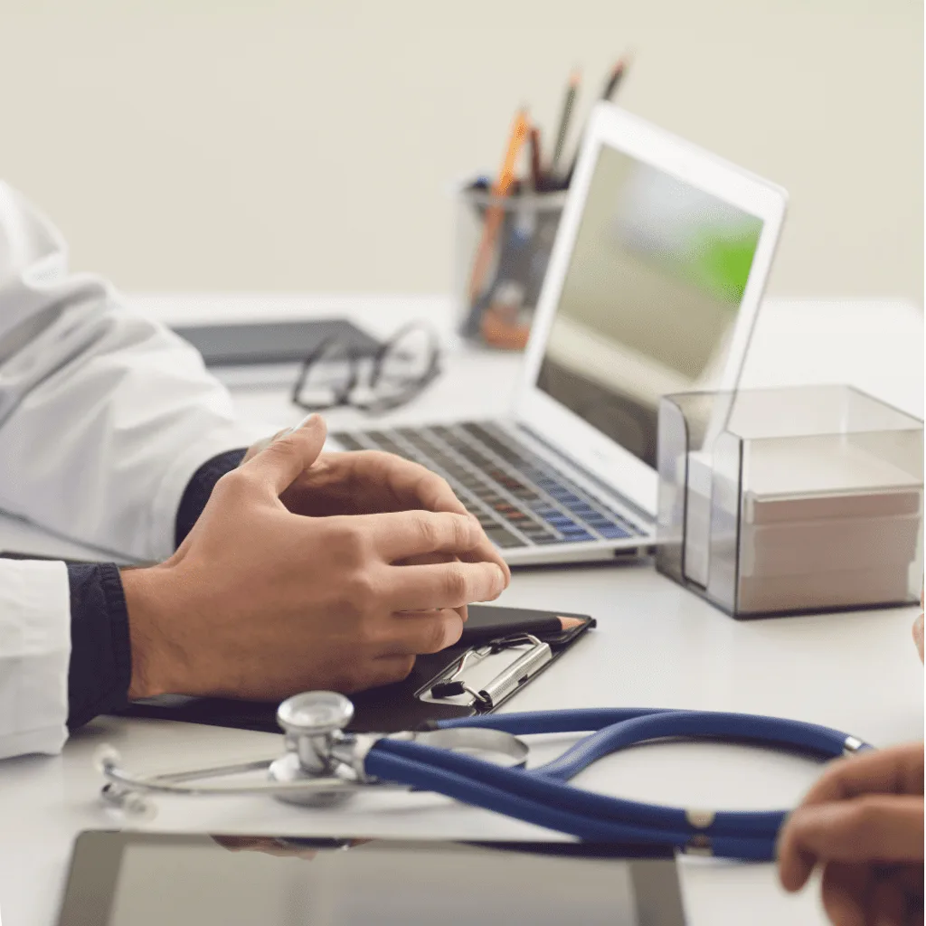 Medical professional reviewing credentialing and enrollment documents at AA MEDS Solutions